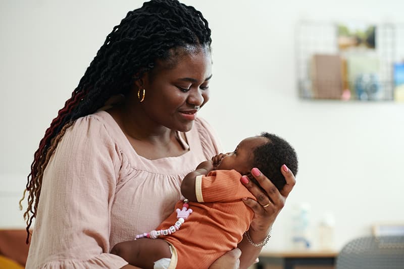 Mother Holding Little Baby Girl
